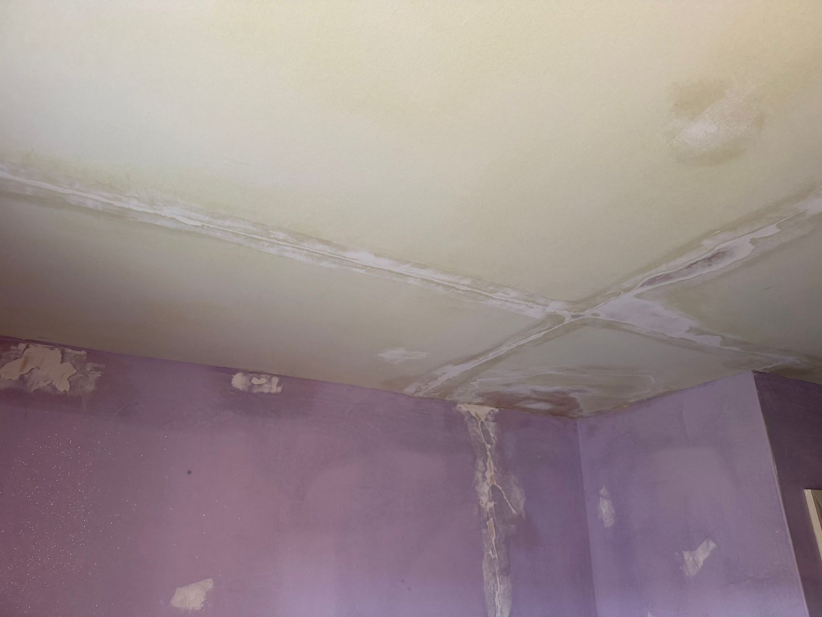 Cracked ceiling and walls prepared extensively for painting