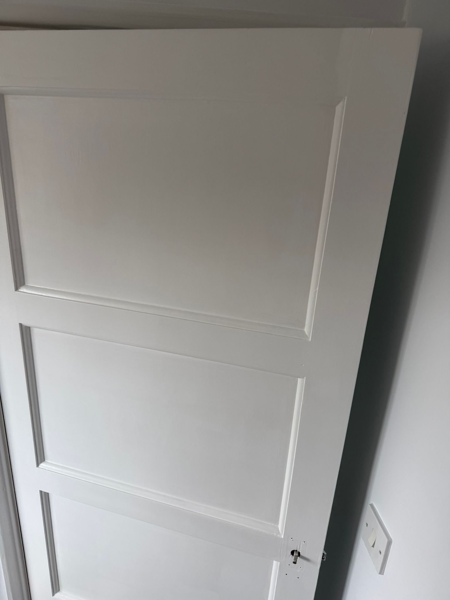 A finished door painted in white